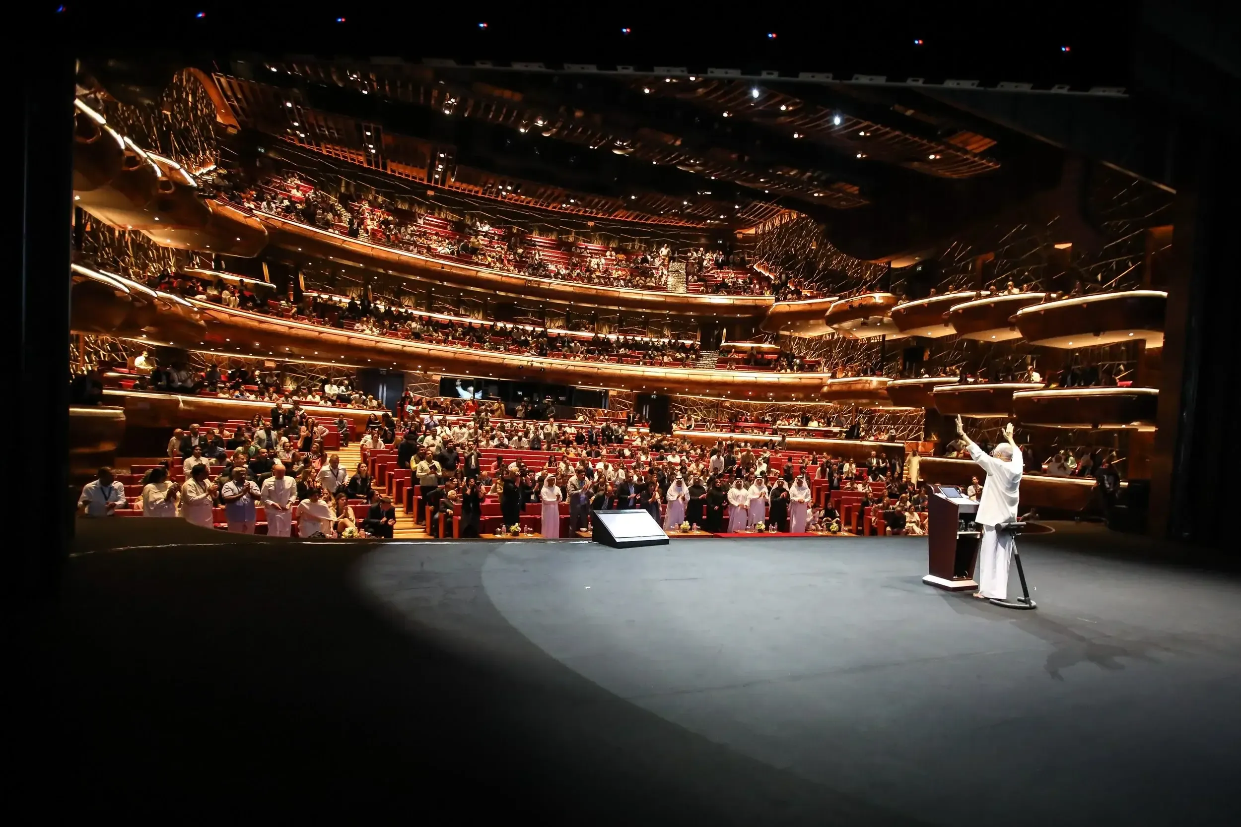 Keynote speaker on stage before a full house at Dubai Opera