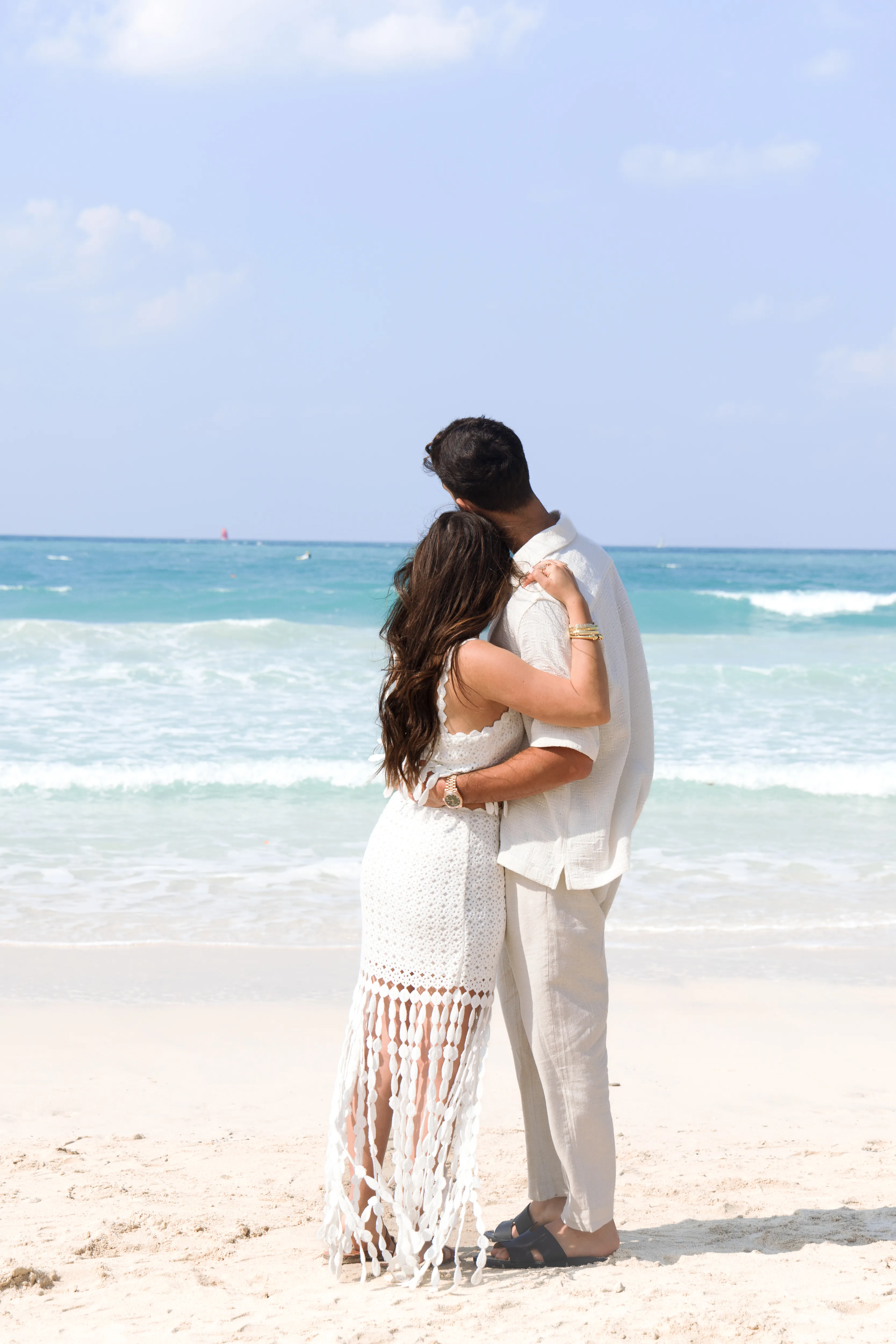 Couple embracing at the shoreline