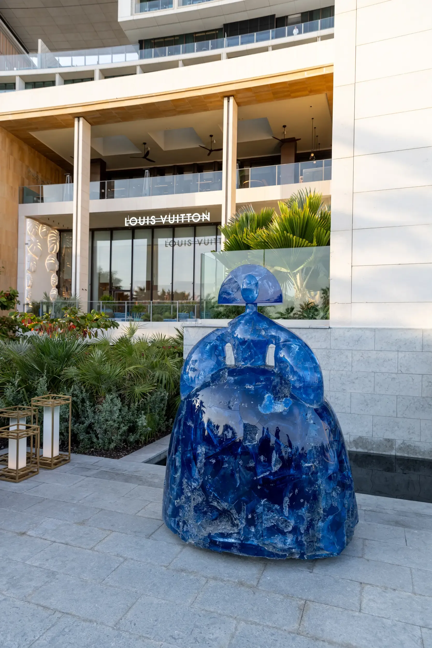 Catalogue shot of a blue Menina-style sculpture with Louis Vuitton motif